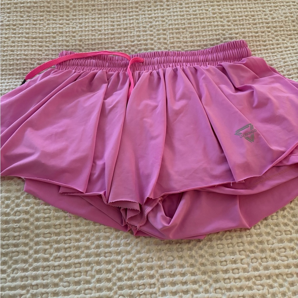 Pink tennis skirt with shorts underneath